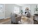 Bright living room featuring modern decor, fresh paint, fireplace, and lots of seating at 717 S A St, Elwood, IN 46036