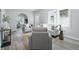 Bright living room featuring modern decor, fresh paint, and lots of seating at 717 S A St, Elwood, IN 46036