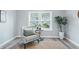 Inviting sitting room with cozy chair and side table next to a large bright window at 717 S A St, Elwood, IN 46036