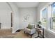 Inviting sitting room with cozy chair and side table next to a large bright window at 717 S A St, Elwood, IN 46036