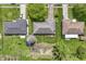 Aerial view of a home showing the roof, driveway and landscaping in relation to the neighboring homes at 7412 Hiner Ln, Indianapolis, IN 46219