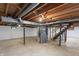 Unfinished basement with exposed ductwork and a small window, ready for your personal touch at 7412 Hiner Ln, Indianapolis, IN 46219