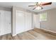 Comfortable bedroom featuring hardwood floors, closet and a view to another room at 7412 Hiner Ln, Indianapolis, IN 46219