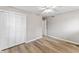 Bedroom featuring hardwood floors, closet and a modern ceiling fan at 7412 Hiner Ln, Indianapolis, IN 46219
