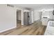 Spacious living area featuring stylish hardwood floors, a cozy brick fireplace, and recessed lighting at 7412 Hiner Ln, Indianapolis, IN 46219