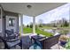 Outdoor patio with seating, view to pond, and backyard at 745 S Summerhaven Ct, New Palestine, IN 46163