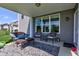 Back porch featuring seating, a table, and a view of the backyard at 745 S Summerhaven Ct, New Palestine, IN 46163