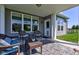 A covered back porch featuring a table, chairs, and a view of the backyard at 745 S Summerhaven Ct, New Palestine, IN 46163