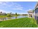 Backyard featuring a pond view and a covered patio at 745 S Summerhaven Ct, New Palestine, IN 46163