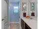Well-lit bathroom featuring modern fixtures, vanity with sink, and blue accents at 745 S Summerhaven Ct, New Palestine, IN 46163