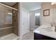 Bathroom with dual sinks, modern cabinets, and glass-enclosed tiled shower at 745 S Summerhaven Ct, New Palestine, IN 46163