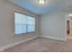 Bright bedroom features large window and neutral colored walls and carpet at 745 S Summerhaven Ct, New Palestine, IN 46163