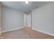 A bedroom showcasing a standard closet door, window, and tan carpet at 745 S Summerhaven Ct, New Palestine, IN 46163