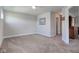Spacious bedroom with neutral walls and carpeting provides a versatile space for rest and relaxation at 745 S Summerhaven Ct, New Palestine, IN 46163