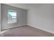 Well-lit bedroom with large window and neutral-toned walls and carpet at 745 S Summerhaven Ct, New Palestine, IN 46163