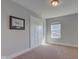 Neutral bedroom with a window, plush carpet, and closet with white doors at 745 S Summerhaven Ct, New Palestine, IN 46163