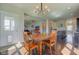 Bright dining area open to the kitchen with pendant lighting at 745 S Summerhaven Ct, New Palestine, IN 46163
