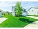A lovely two-story home with a green lawn and tree in the front yard, offering curb appeal at 745 S Summerhaven Ct, New Palestine, IN 46163