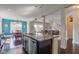 Open concept kitchen features granite counters, stainless appliances, island and view of dining and living areas at 745 S Summerhaven Ct, New Palestine, IN 46163
