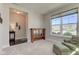 Bright living room with large window, neutral carpet, and cozy seating area at 745 S Summerhaven Ct, New Palestine, IN 46163
