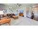 Large living room with a comfortable brown leather sofa, coffee table, and natural light at 745 S Summerhaven Ct, New Palestine, IN 46163