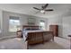 Spacious main bedroom with ceiling fan, two windows, and natural lighting at 745 S Summerhaven Ct, New Palestine, IN 46163