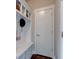 Mudroom features coat hooks, storage bench, and convenient access to other areas of the home at 745 S Summerhaven Ct, New Palestine, IN 46163
