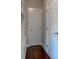 Mudroom featuring a bench and storage, conveniently located near a closet and side entrance at 745 S Summerhaven Ct, New Palestine, IN 46163