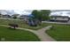 Community playground with slides, climbing structures, ride-on toys, and park benches is a fun outdoor space at 745 S Summerhaven Ct, New Palestine, IN 46163