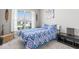 Bright bedroom with a large window, patterned bedding, and stylish decor at 75 Hovden Dr, Cicero, IN 46034