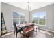 Charming dining area with a wooden table, bench seating, and lots of natural light at 75 Hovden Dr, Cicero, IN 46034