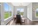 Dining area with large windows and views of the backyard at 75 Hovden Dr, Cicero, IN 46034