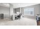 Home office space featuring a built-in desk, natural light, and neutral walls at 75 Hovden Dr, Cicero, IN 46034