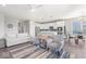 Bright, open-concept living room with modern furniture, flowing into a stylish kitchen and dining area at 75 Hovden Dr, Cicero, IN 46034
