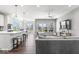 Open-concept living room and kitchen featuring modern appliances, hardwood floors, and natural light at 75 Hovden Dr, Cicero, IN 46034