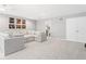 Spacious living room featuring plush gray sectional sofa and contemporary wall art at 75 Hovden Dr, Cicero, IN 46034