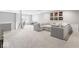 Inviting living room offers a comfortable sectional, neutral decor, and ample natural light at 75 Hovden Dr, Cicero, IN 46034