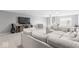 Open-concept living room features a large sectional sofa and entertainment center with TV at 75 Hovden Dr, Cicero, IN 46034