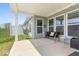 Relaxing covered patio with stylish furniture and a hammock, perfect for outdoor enjoyment at 75 Hovden Dr, Cicero, IN 46034