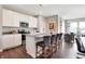 Modern kitchen with stainless steel appliances, a center island with bar stools, and sleek cabinetry at 7608 Allesley Dr, Avon, IN 46123