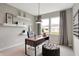 Stylish study featuring sleek desk, shelving, and natural light for a productive workspace at 7608 Allesley Dr, Avon, IN 46123