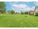 Expansive backyard perfect for outdoor activities and entertaining, with lawn and trees at 801 Echo Trl, Martinsville, IN 46151