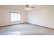 Light-filled bedroom with neutral carpet, large window, and baseboard molding at 801 Echo Trl, Martinsville, IN 46151