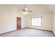Bright bedroom features vaulted ceilings, neutral walls, and a ceiling fan at 801 Echo Trl, Martinsville, IN 46151