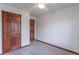 Clean bedroom featuring fresh carpet, white walls, and wooden doors and trim at 801 Echo Trl, Martinsville, IN 46151