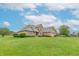 Expansive view of a well-maintained home with a lush green lawn at 801 Echo Trl, Martinsville, IN 46151