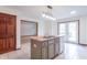 Spacious kitchen boasts a stylish island with stainless steel sink and modern light fixture at 801 Echo Trl, Martinsville, IN 46151