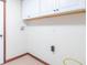 Functional laundry area with upper cabinets and convenient hookups for appliances at 801 Echo Trl, Martinsville, IN 46151
