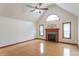 Spacious living room with vaulted ceilings, hardwood floors, and a fireplace at 801 Echo Trl, Martinsville, IN 46151