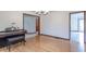 Light and airy room featuring hardwood floors and a piano at 801 Echo Trl, Martinsville, IN 46151